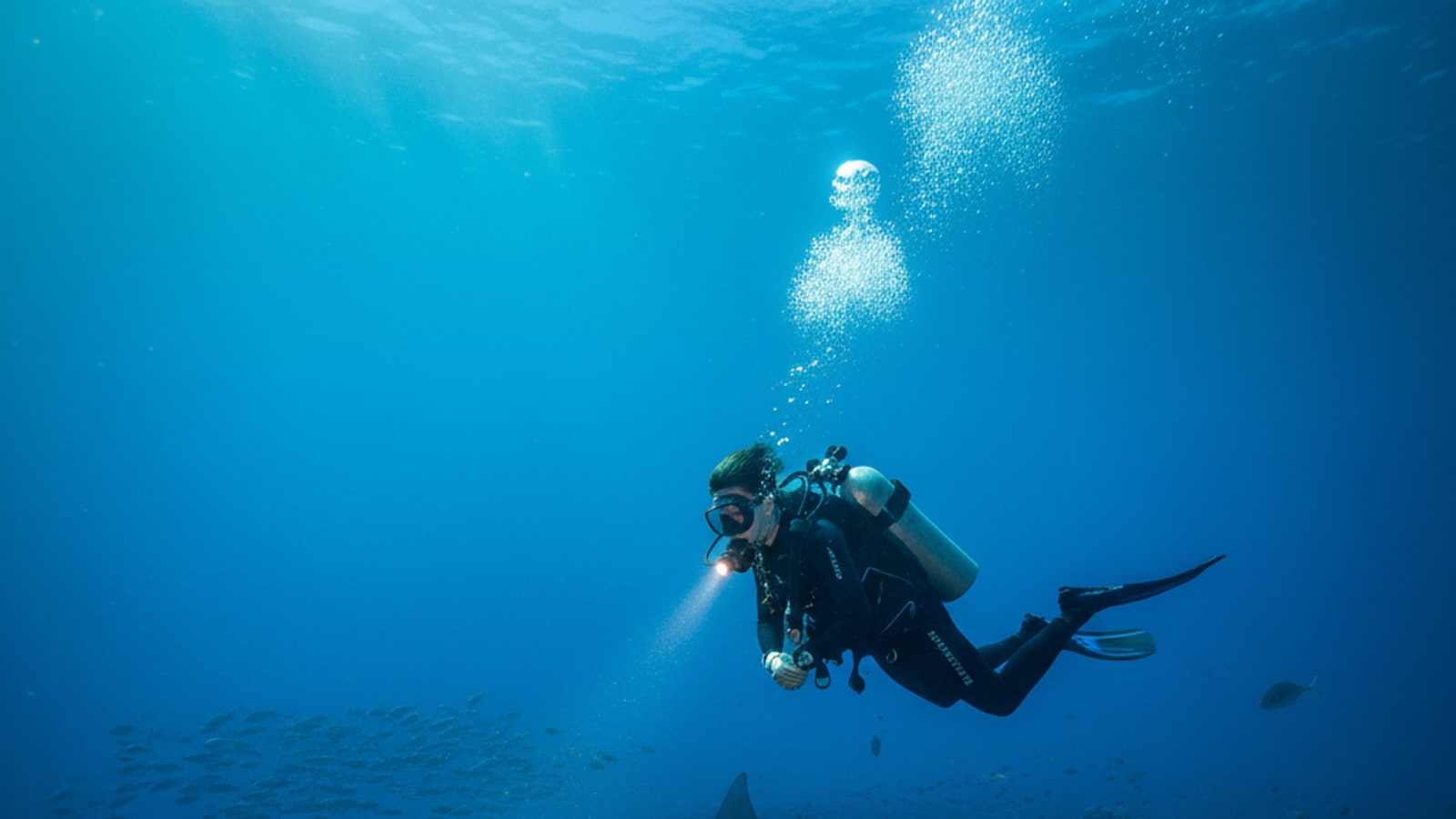 How deep can a 15-year-old scuba dive?