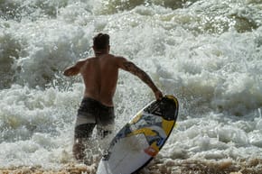 Why Do Surfers Run With Their Boards?