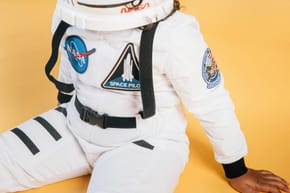 Why Do Astronauts Wear Orange Suits?