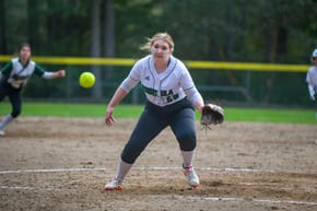 Why Does a Softball Pitcher Use a Windmill to Wind Up?